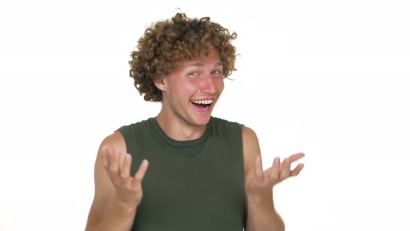 Picture of American Curly Guy in Green Muscle Shirt Make Face on Camera Laughing Out Loud Gesturing