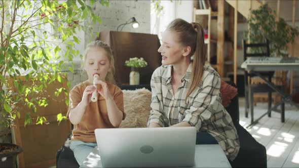 The Tutor Teaches the Girl to Play the Flute