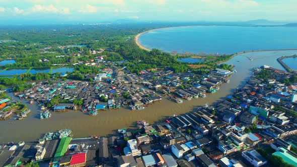 Drones are flying over Pak Nam Chumphon village during sunrise