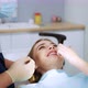 Beautiful Positive Female Patient Shows Teeth to the Dentist After Treatment - VideoHive Item for Sale