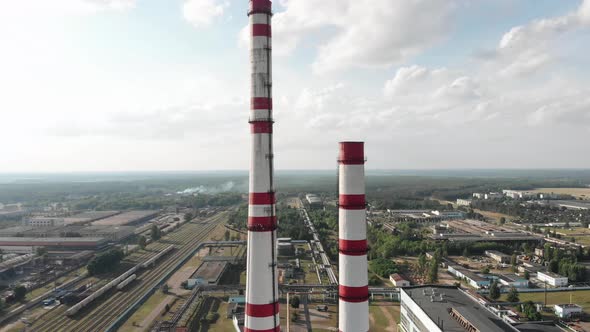 Drone Shooting of Chimneys Against a Cloudy Sky on the Territory of a Thermal Power Plant