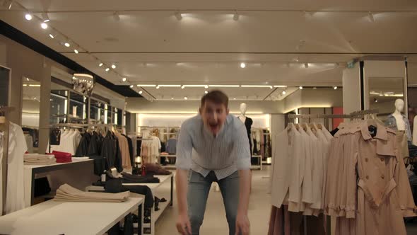 Happy Man Dancing in Shop