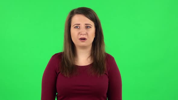 Portrait of Frightened Girl Says Wow with Shocked Facial Expression, Green Screen