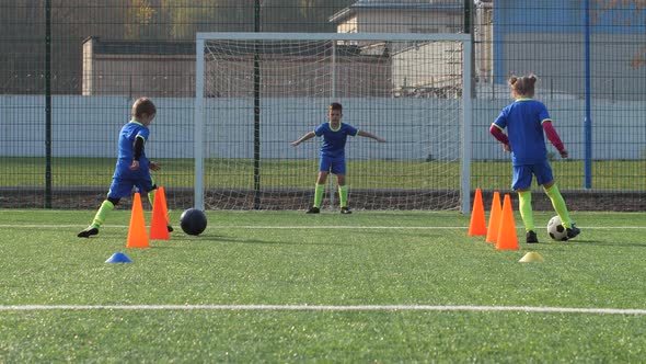 Preteen Soccer Players Training on Football Field