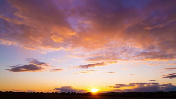 Clouds Fly Across the Sky at Sunset