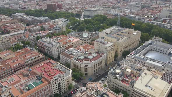Drone is Flying Over the Building with a Radio Tower on Top of It Flag Spain