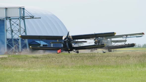 LightEngine Propeller Aircraft with a Rotating Propeller Stands at the Hangar