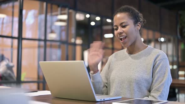 Online Video Chat By African Woman on Laptop at Home