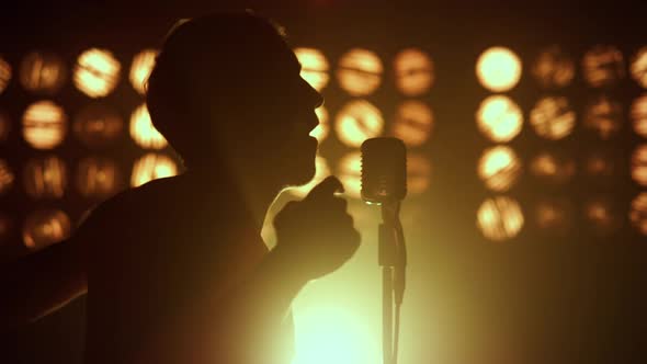 Silhouette Unknown Performer Singing in Club Closeup