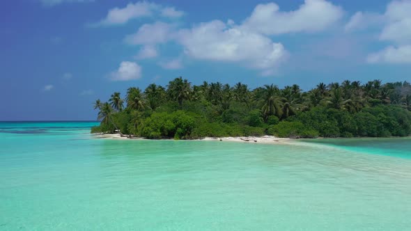 Aerial panorama of marine seashore beach voyage by transparent lagoon and clean sandy background of 