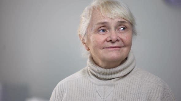 Beautiful Elderly Lady Listening to Music, Nostalgic Mood, Pleasant Memories