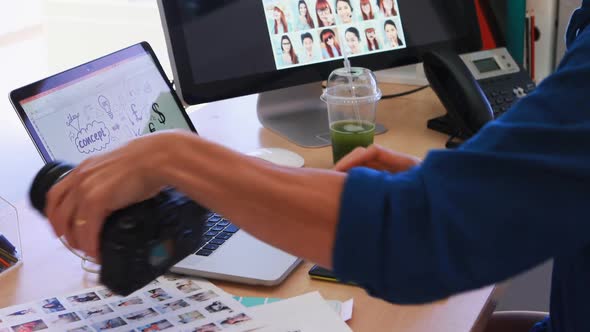 Male executive working over laptop at his desk 4k