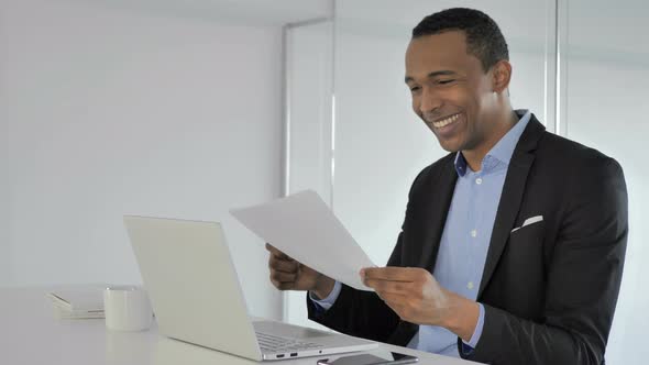 Casual Afro-American Businessman Reacting To Successful Contract