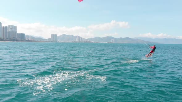 Aerial View of the City Beach and Active People Practicing Kite Surfing and Windsurfing. Kitesurfing