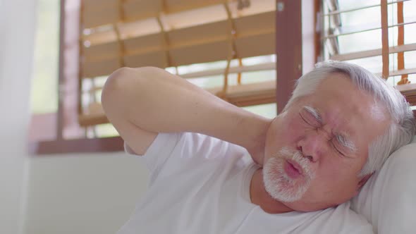 Asian Elderly senior man neck and shoulder pain and injury muscle upper back problem