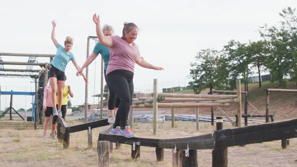 Caucasian women exercising at bootcamp