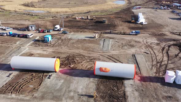 High Angle View on the Huge Parts of the Wind Turbines on the Ground, 