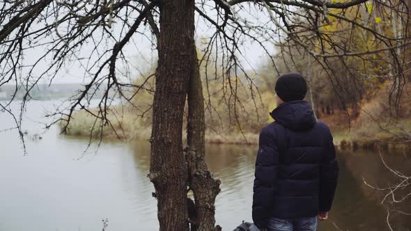 Backpacker tourist near river