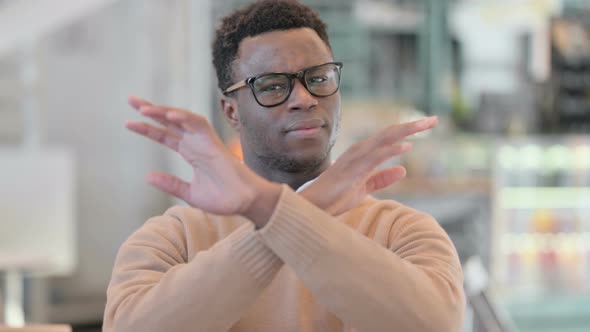 Creative African Man Showing No Sign By Shaking Head