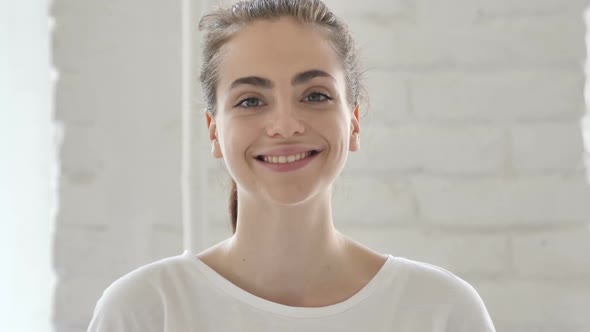 Smiling Young Woman in Office