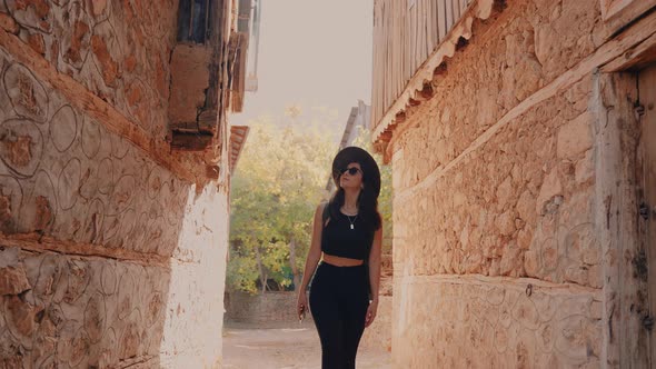 Woman Walking on Historical Street