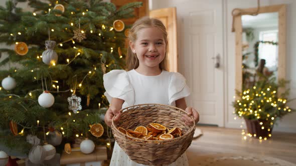 Portrait of cute girl with natural Christmas decorations. Shot with RED helium camera in 8K