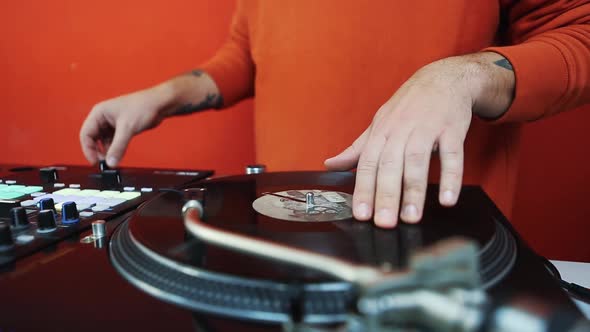 Professional dj scratching vinyl record on retro turn table player