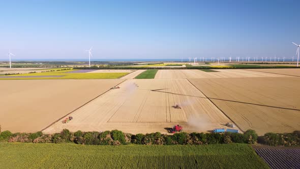 Harvester Machine Working in Wheat Field Aerial View