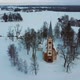 Aerial Top View of the Krimulda Evangelic Lutheran Church in Winter at Sunrise Latvia 4k Video - VideoHive Item for Sale