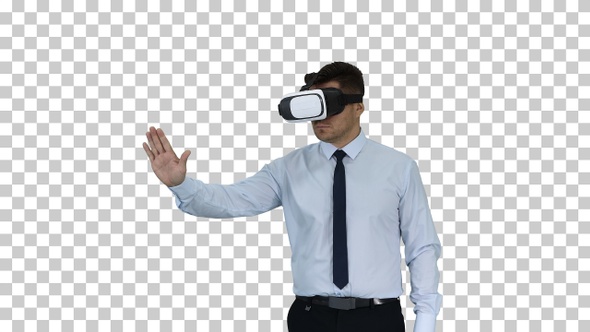 Businessman in VR glasses and interacting with virtual reality