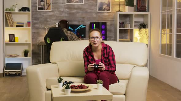 Young Woman Excited After Her Victory While Playing Video Games