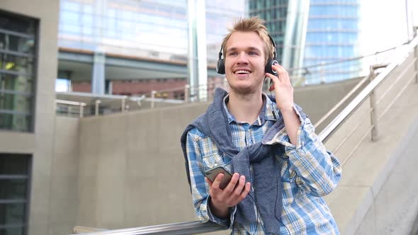 Young man relaxing and listening to music