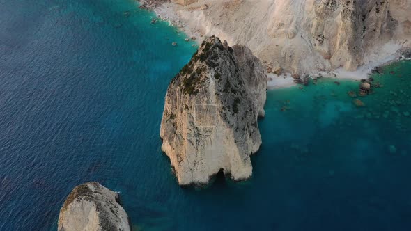 Aerial seascape at the day time. Bay and rocks. Blue water background in the summer.