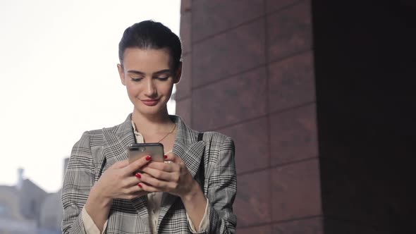 Beautiful Business Woman With Phone Outdoors Portrait