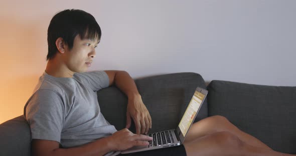 Man Using Computer at Home 