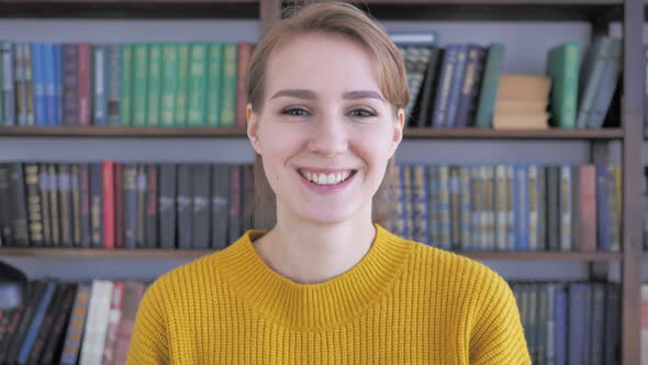 Portrait of Smiling Young Woman Looking at Camera