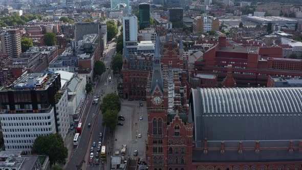 Slide and Pan Aerial Footage of Victorian Style Brick Building of St Pancras Train Station and Hotel