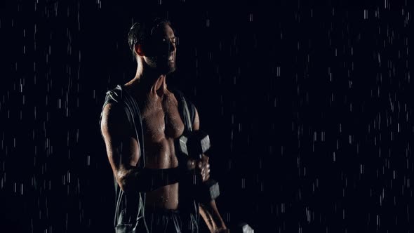 Athletic Man Working Out In The Rain