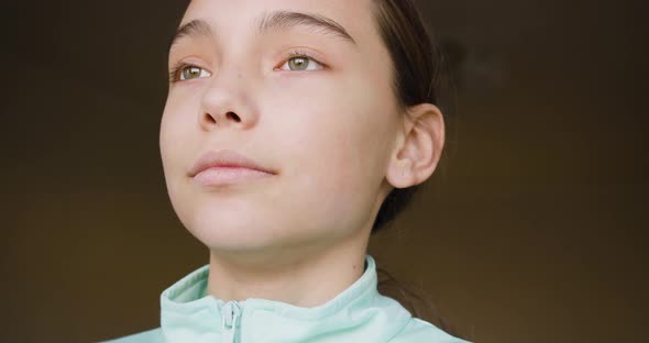 10 Years Old Girl Wearing Headphones Looking at Camera and Smiling