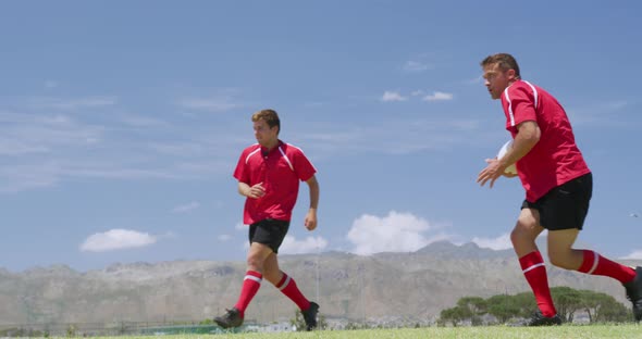 Rugby players having match on field