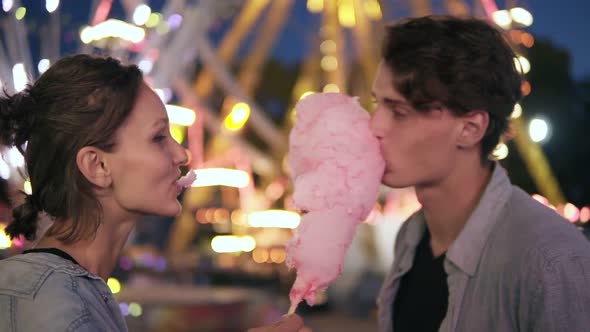 Two Hipsters on Dating in Funfair at Night
