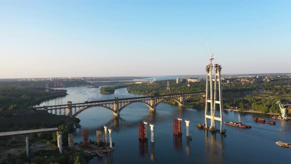 Incomplete Automobile Bridge and Arch Bridge in the Background of Hydroelectric Power Station