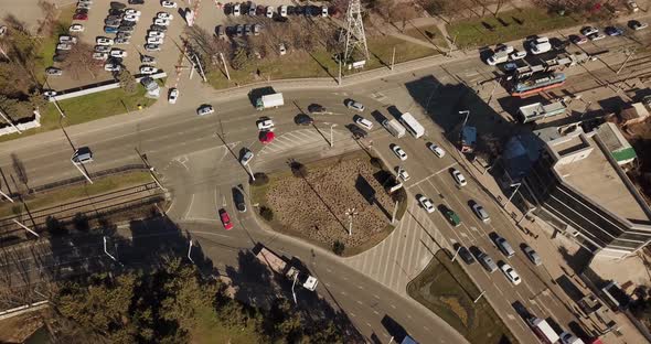 Vertical Aerial Top Down View Shot Rotating, Descending and Looking Down on Street Traffic.