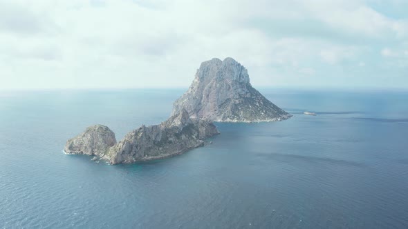 Aerial view moving towards Es Vedra Ibiza, Spain.