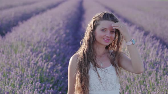 Young Beautiful Girl in Front of the Lavender Field