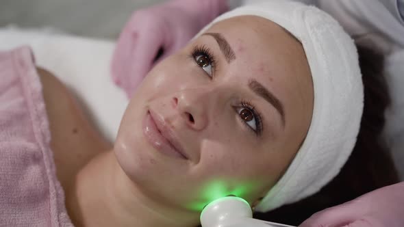 Close View of Laser Cosmetology Procedure for Beautiful Female Patient in Salon