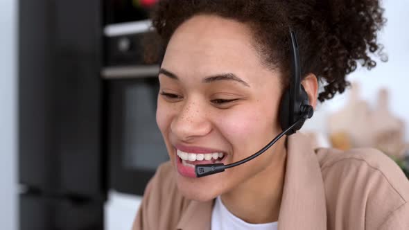 Closeup of Successful Pleasant African American Girl with Headset Expert Consultant or Call Center