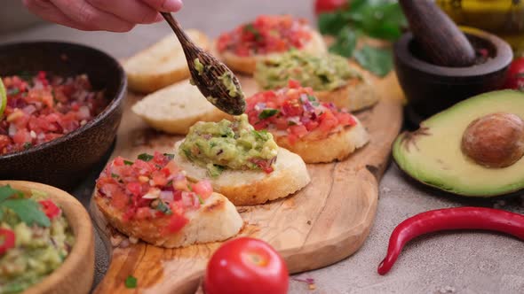 Making a Vegan Healthy Breakfast  Tomato Salsa and Guacamole on Whole Grain Bread Bruschetta