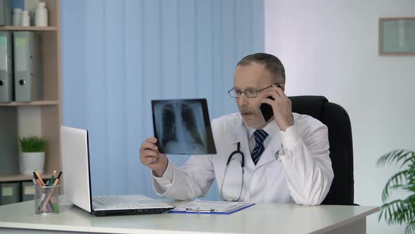 General Practitioner Calling His Oncologist Colleague to Discuss Lungs X-Ray