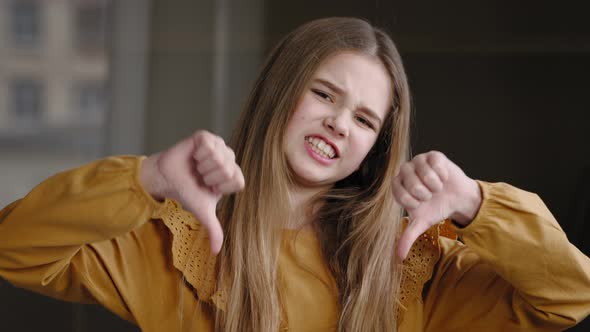 Indoor Portrait Emotional Girl Teenager Child Pupil Schoolgirl Caucasian Kid Showing Dislike Gesture